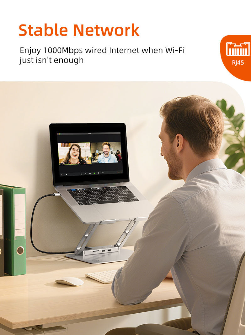 Man in video call using stable wired Ethernet connection via laptop docking station.