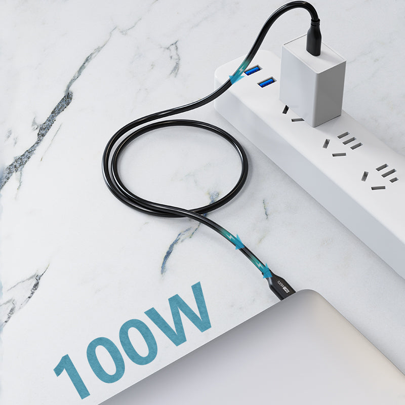 Black USB-C cable connecting a USB-C wall charger to a laptop; charger and laptop are not included.
